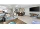 Inviting living and dining area with a large flat-screen TV and decorative furnishings at 479 E Shore Dr # 5, Clearwater, FL 33767