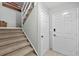 Carpeted staircase leading to the next floor with a decorative paddle accent at 479 E Shore Dr # 5, Clearwater, FL 33767