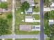 This aerial view shows a property with a well-maintained lawn and ample parking space at 4802 18Th St, Zephyrhills, FL 33542