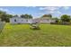 Large backyard with picnic table is perfect for outdoor entertaining and play at 4802 18Th St, Zephyrhills, FL 33542