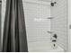 A clean, tiled bathtub and shower combo is the highlight of this bright and airy bathroom at 4802 18Th St, Zephyrhills, FL 33542