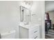 Bathroom vanity with a marble countertop and a view into an adjacent bedroom at 4802 18Th St, Zephyrhills, FL 33542