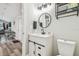 A stylish bathroom vanity with a sleek mirror and a storage cabinet at 4802 18Th St, Zephyrhills, FL 33542