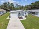 Inviting single-story home boasts a one car garage, freshly landscaped yard, and a cozy front porch at 4802 18Th St, Zephyrhills, FL 33542