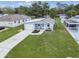 A well-maintained single-Gathering home with a freshly painted exterior, attached garage, and lush green lawn at 4802 18Th St, Zephyrhills, FL 33542