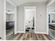 Hallway between two bedrooms, with an open door to a full bathroom at 4802 18Th St, Zephyrhills, FL 33542