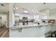 Kitchen with stainless steel appliances, granite counters, breakfast bar, and white cabinetry at 4802 18Th St, Zephyrhills, FL 33542