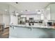 Kitchen with stainless steel appliances, granite counters, breakfast bar, and white cabinetry at 4802 18Th St, Zephyrhills, FL 33542