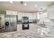 Spacious kitchen with stainless steel appliances, granite countertops and white cabinets at 4802 18Th St, Zephyrhills, FL 33542