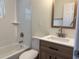 Newly renovated bathroom with modern vanity, sleek fixtures, and tiled shower/tub combo at 502 Johnson Rd, Plant City, FL 33566