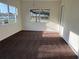 Bedroom featuring plush carpeting, neutral-colored walls, and natural light from two windows at 502 Johnson Rd, Plant City, FL 33566