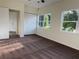 Bedroom featuring carpeting, neutral-colored walls, closet, and natural light from windows at 502 Johnson Rd, Plant City, FL 33566