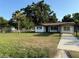 Charming single-story home with a well-maintained lawn and mature trees at 502 Johnson Rd, Plant City, FL 33566