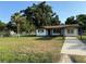 Charming single-story home featuring a well-manicured lawn and covered front entrance, perfect for curb appeal at 502 Johnson Rd, Plant City, FL 33566