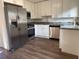 Modern kitchen featuring stainless steel appliances, granite countertops, and bright white cabinets at 502 Johnson Rd, Plant City, FL 33566
