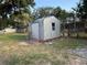 Storage shed in backyard with corrugated metal siding at 502 Johnson Rd, Plant City, FL 33566