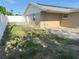 Backyard view showcasing a patio, green lawn, and full fencing around the property at 5139 Victoria Ln, Holiday, FL 34690