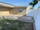 Backyard view featuring a patio area and fenced yard at 5139 Victoria Ln, Holiday, FL 34690