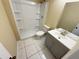 Neutral bathroom with new fixtures, ceramic tile floors, single vanity, and tiled shower and tub at 5139 Victoria Ln, Holiday, FL 34690