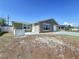 Charming one-story home featuring an attached garage, and driveway, set against a clear blue sky at 5139 Victoria Ln, Holiday, FL 34690