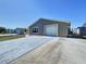 Lovely house featuring fresh exterior paint, large window, one-car garage and freshly painted driveway at 5139 Victoria Ln, Holiday, FL 34690