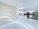 Bright, open-concept kitchen with large island, stainless steel appliances, and tile floors at 5139 Victoria Ln, Holiday, FL 34690