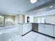 Modern kitchen with stainless steel appliances, granite countertops, and large island for entertaining at 5139 Victoria Ln, Holiday, FL 34690