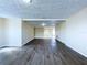 An expansive living room with wood-look floors and neutral walls that create a bright and inviting atmosphere at 5139 Victoria Ln, Holiday, FL 34690