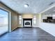 Bright living room with fireplace and sliding glass door leading to the backyard and open kitchen at 5139 Victoria Ln, Holiday, FL 34690