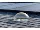 Close-up of a roof with solar panels and a clear dome skylight for natural lighting at 5139 Victoria Ln, Holiday, FL 34690