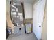 Utility room featuring a modern HVAC system and water heater for the home's climate control and hot water needs at 5139 Victoria Ln, Holiday, FL 34690