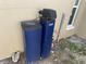 Maytag water filtration system components located outside the home, with a window visible in the background at 5139 Victoria Ln, Holiday, FL 34690
