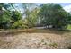 Expansive backyard with mature trees, shrubs and a gazebo at 5405 S Sellas St, Tampa, FL 33611