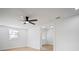 Bright bedroom with hardwood floors, a ceiling fan, a large window, and neutral paint at 5405 S Sellas St, Tampa, FL 33611