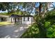 Charming single-story home with black and white exterior and long driveway at 5405 S Sellas St, Tampa, FL 33611