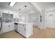 Renovated kitchen with white cabinets, stainless steel appliances, black accents, and quartz countertops at 5405 S Sellas St, Tampa, FL 33611