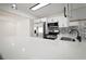 Close-up of the renovated kitchen featuring stainless steel appliances and a unique backsplash at 5405 S Sellas St, Tampa, FL 33611