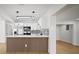 Modern kitchen features white cabinets, stainless steel appliances, black hardware, and a stylish backsplash at 5405 S Sellas St, Tampa, FL 33611