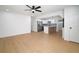Open-concept living room flows into a modern kitchen with stainless steel appliances and a breakfast bar at 5405 S Sellas St, Tampa, FL 33611
