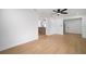 Open living room with hardwood floors and access to the kitchen and rest of the house at 5405 S Sellas St, Tampa, FL 33611