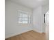 Bright office featuring neutral paint, hardwood floors, natural light, and access to other rooms at 5405 S Sellas St, Tampa, FL 33611