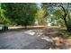 Backyard patio with brick pavers, mature trees and partial privacy fence at 5405 S Sellas St, Tampa, FL 33611