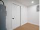 Utility room featuring a water heater, storage, and a white door at 5405 S Sellas St, Tampa, FL 33611