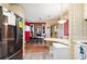Eat-in kitchen with stainless steel appliances, a refrigerator and breakfast bar seating at 5409 Antigua Dr, Zephyrhills, FL 33541