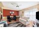 Comfortable living room with natural light, neutral colored walls, and light hardwood floors at 5409 Antigua Dr, Zephyrhills, FL 33541