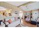 Inviting living space with wood-look walls, comfortable seating, and an open view to the kitchen area at 5409 Antigua Dr, Zephyrhills, FL 33541