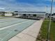 Daytime shot of the shuffleboard courts, highlighting the playing area and covered seating for a comfortable playing experience at 5409 Antigua Dr, Zephyrhills, FL 33541
