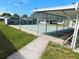 Scenic view of the community shuffleboard court with covered seating, providing a relaxing and recreational outdoor space at 5409 Antigua Dr, Zephyrhills, FL 33541