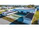Aerial view of the shuffleboard courts at the community clubhouse, surrounded by well-maintained grounds and residential homes at 5409 Antigua Dr, Zephyrhills, FL 33541