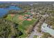 Aerial shot of baseball fields offering expansive green spaces, set within a lush, wooded area at 56 Bay Woods Dr, Safety Harbor, FL 34695